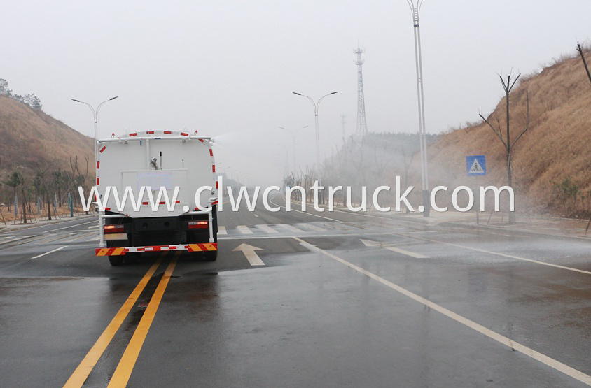 street water spray truck in action 3